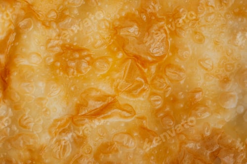 Preview: Close up of a golden cheburek pastry texture