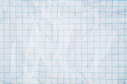 Preview: White squared paper texture with blue grid pattern and wrinkled folded surface backdrop