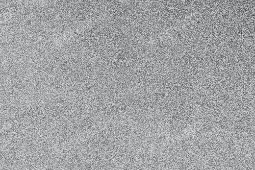 Preview: Detailed rough textured surface of natural gray speckled stone material showing a very fine granular
