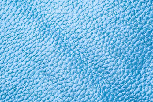 Preview: Close up texture of blue leather surface with fine grain for backgrounds