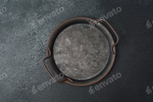 Preview: Round metal tray on a dark textured surface with minimalistic design