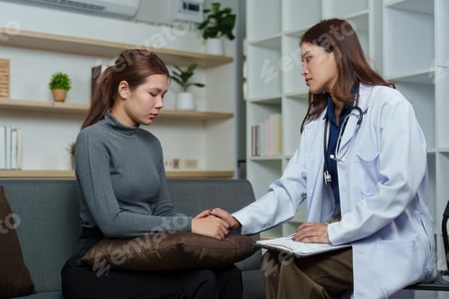 Preview: Woman Doctor Offering Support and Comfort To Patient