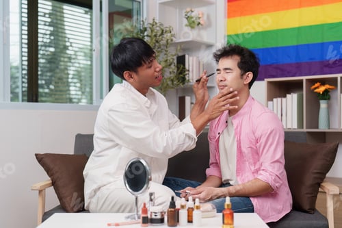 Preview: Men enjoying makeup session in a pride-themed room