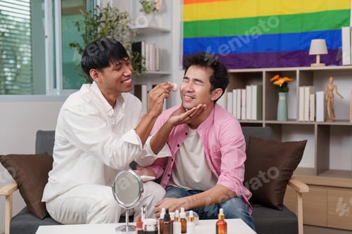 Preview: Couple applying makeup in a cozy living room
