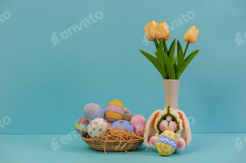 Preview: Easter Celebration. Colorful decorated eggs in a basket with tulips for festive spring decor.