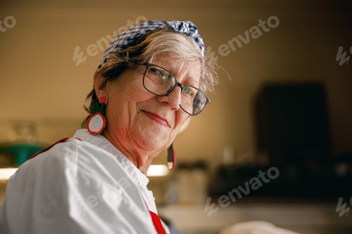Preview: Joyful Elderly Caucasian Woman Authentically Smiling in a Warm Kitchen Environment