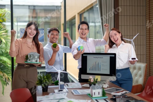 Preview: Business team cheering for sustainable eco friendly success