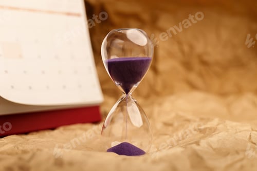 Preview: Hourglass beside calendar, time management, aging society and awareness
