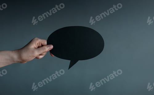 Preview: Holding blank speech bubble in dark , Social pressure, emotional expression, mental health
