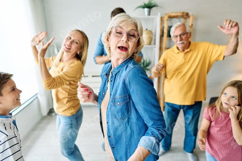 Preview: Happy Multi-Generational Family Dancing Together in a Bright Living Room