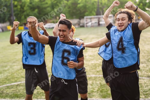 Preview: Excited soccer players cheering and celebrating a victory on the field. Teamwork, bonding, and succe