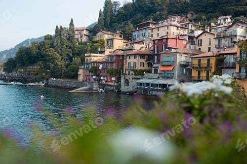 Preview: Beautiful close-up of flowers on the lakeside walkway fence in Varenna village, Lake Como, Italy.