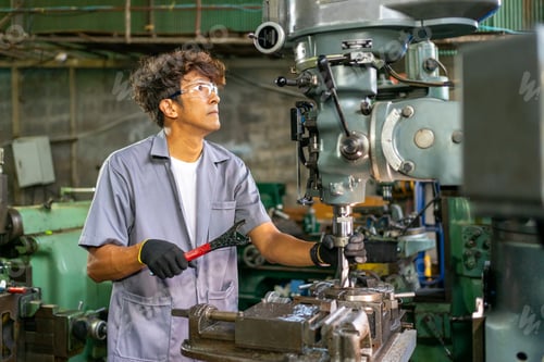 Preview: Engineer Operating Lathe Machine in Industrial Workshop