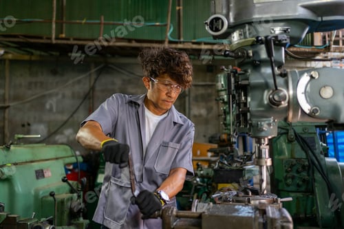 Preview: Engineer Operating Lathe Machine in Industrial Workshop