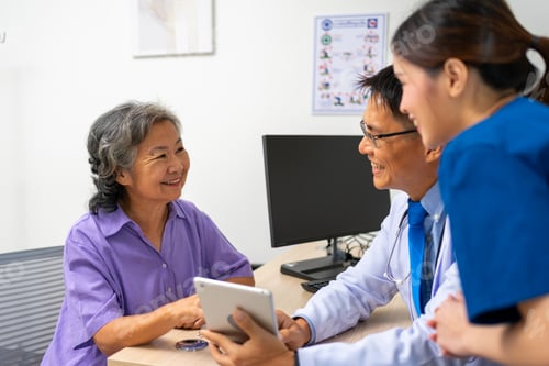 Preview: Doctor and patient reviewing tablet results together in clinic
