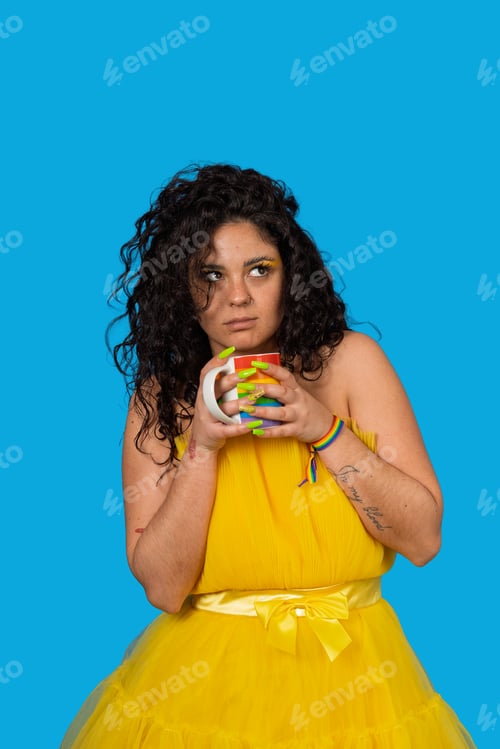 Preview: Woman holding rainbow mug promoting lgbtq+ pride