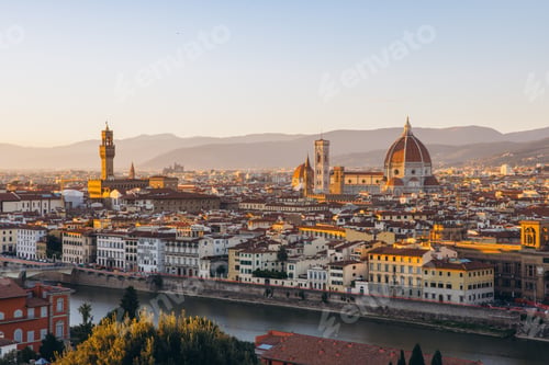 Preview: Florence cityscape at sunset revealing Duomo, Palazzo Vecchio, and Arno River, historic Italian arch