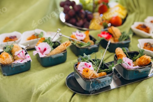 Preview: Catering table with gourmet finger food appetizers, beautifully arranged for a special event or part