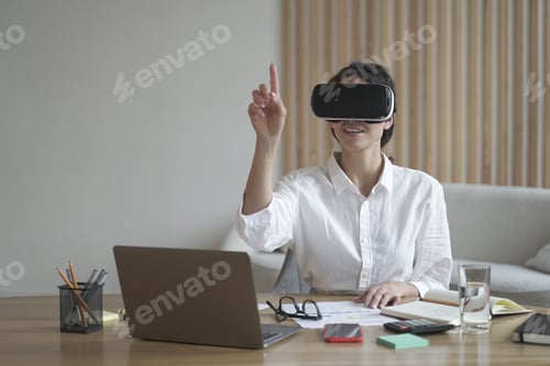Preview: Female office worker in vr headset interacting with digital interface, touching 3d objects