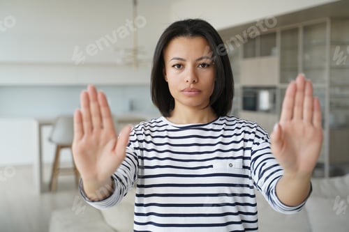Preview: Woman gesturing no with hands, shows rejection. Stop abuse and domestic violence.