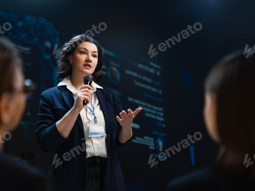 Preview: Confident Businesswoman Giving Inspiring Presentation at Technology Conference