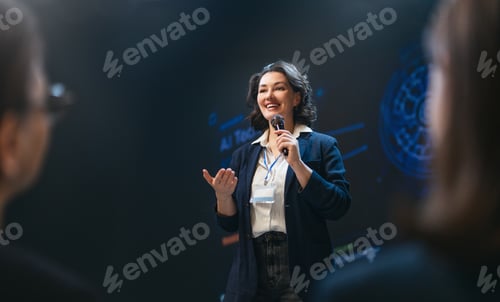 Preview: Confident Businesswoman Speaking at Technology Conference, Inspiring Audience