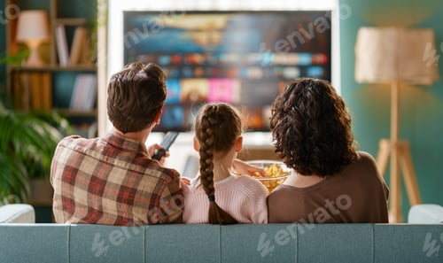 Preview: Happy Family Watching TV Together at Home and Enjoying Movie Night With Popcorn