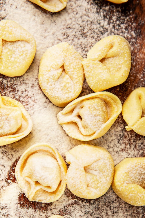 Preview: Raw ravioli pasta cooking flour and dough on the table tasty snack fresh delicious gourmet food back