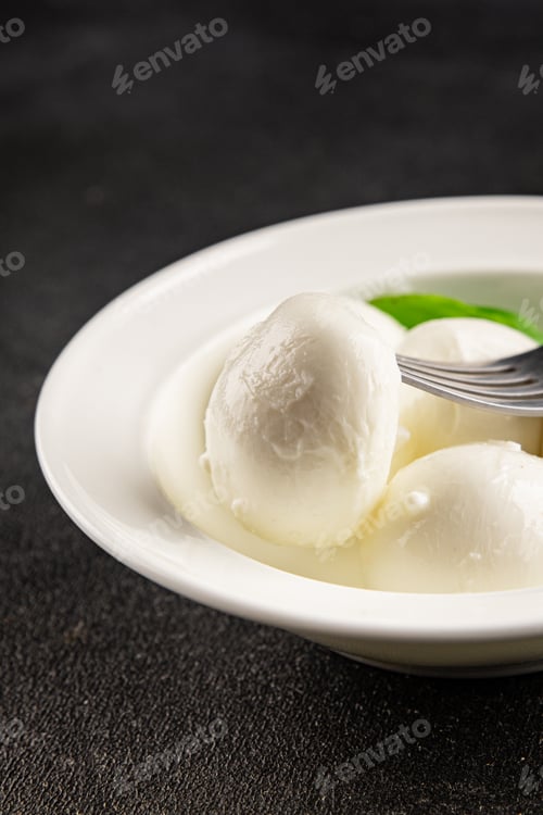 Preview: Mini mozzarella or mini burrata soft, young cheese lunch or dinner tasty snack organic fresh and del