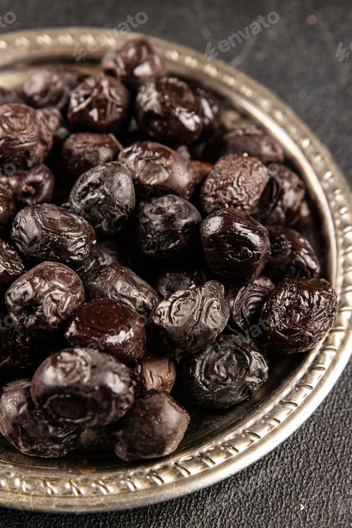 Preview: Black olives fresh dried smoked olive tasty snack fresh gourmet food background on the table rustic