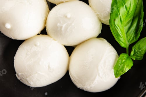 Preview: Mini mozzarella or mini burrata soft, young cheese lunch or dinner tasty snack organic fresh and del