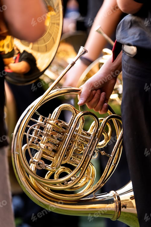 Preview: Young spanish musicians performing a street concert with a french horn