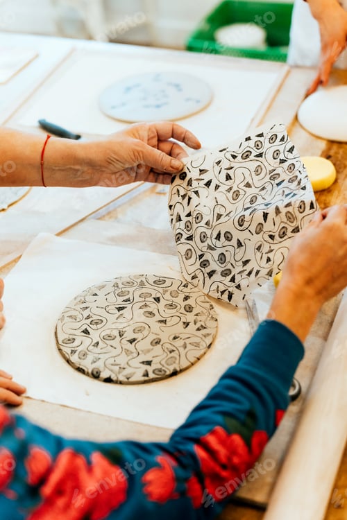 Preview: Artisanal ceramic production process applying a decorative pattern to clay art