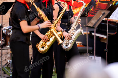 Preview: Young spanish musicians performing an outdoor concert with saxophones