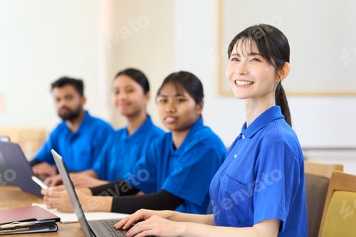 Preview: Asian caregivers receiving training at a nursing care facility