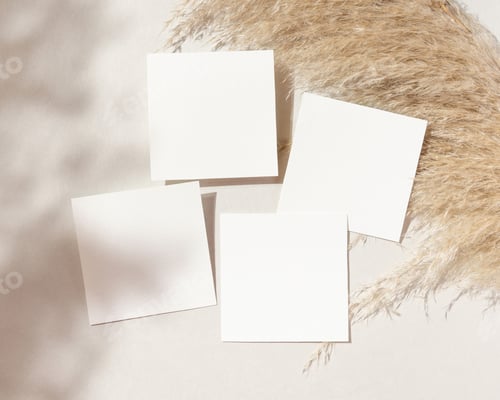 Preview: Blank square cards mockup on pampas grass and beige stone top view, boho wedding stationery
