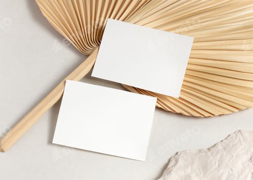 Preview: Blank sided cards set mockup with dried palm leaf on beige stone top view, wedding stationery