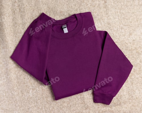 Preview: Blank purple unisex sweatshirt mockup, folded apparel template with copy space on front and sleeve