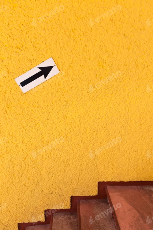 Preview: Arrow pointing up on bright yellow wall, Cancun, Yucatan Peninsula, Quintana Roo