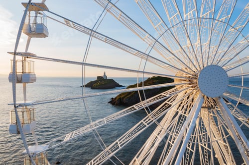 Preview: Ferris Wheel and the view through the framework to the Mumbles Lighthouse offshore