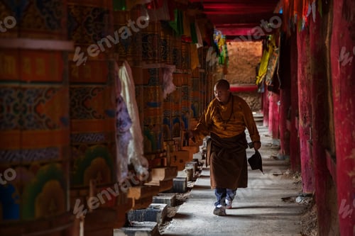 Preview: Tibetan Man Turning the Prayer Wheels in the temple at
Dongpojia, Sichuan Province, Kham Tibet.