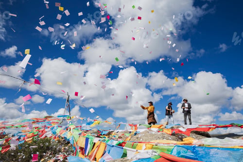 Preview: The paper squares, longda (Tibetan for Winged Horse) are launched into the wind by people on a hillt