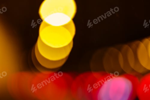 Preview: Blurred headlights and tail lights at night, abstract patterns.