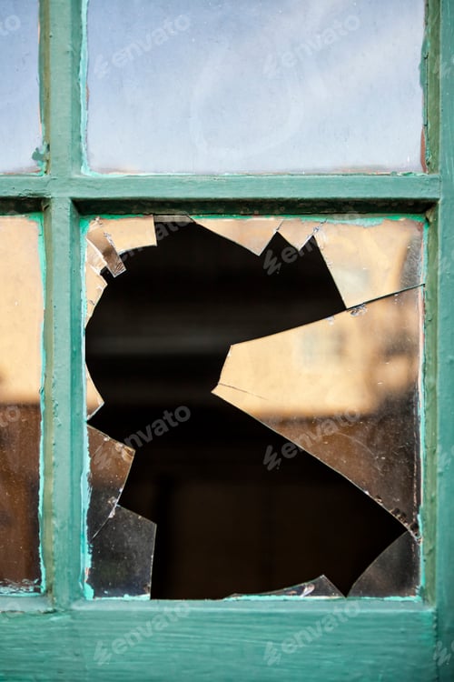 Preview: Closeup of broken glass in window pane