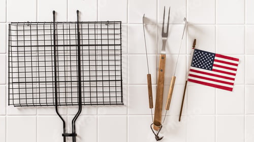 Preview: Barbecue grill grate and American flag on white background