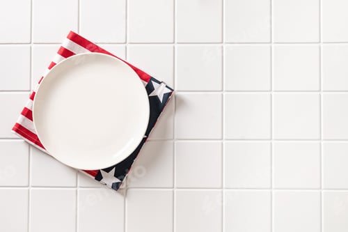 Preview: Empty patriotic plate on white background with copy space
