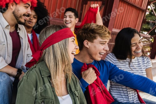 Preview: Diverse red sport fans supporting their team - Soccer supporters having fun at football stadium