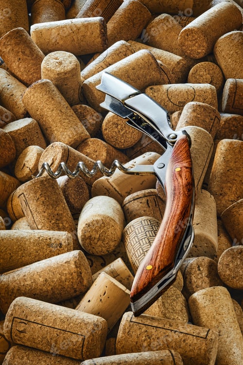 Preview: Wine opener on a heap of used wine bottle cork closures