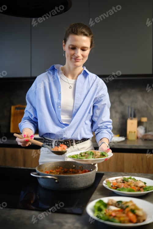 Preview: Cooking in a modern kitchen while preparing meals with fresh ingredients in the early evening