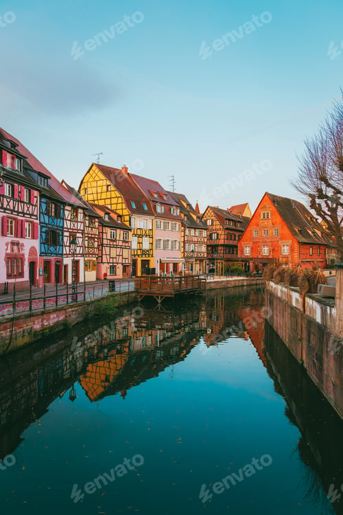 Preview: Colmar Alsatian street at sunrise with empty road and warm golden facades